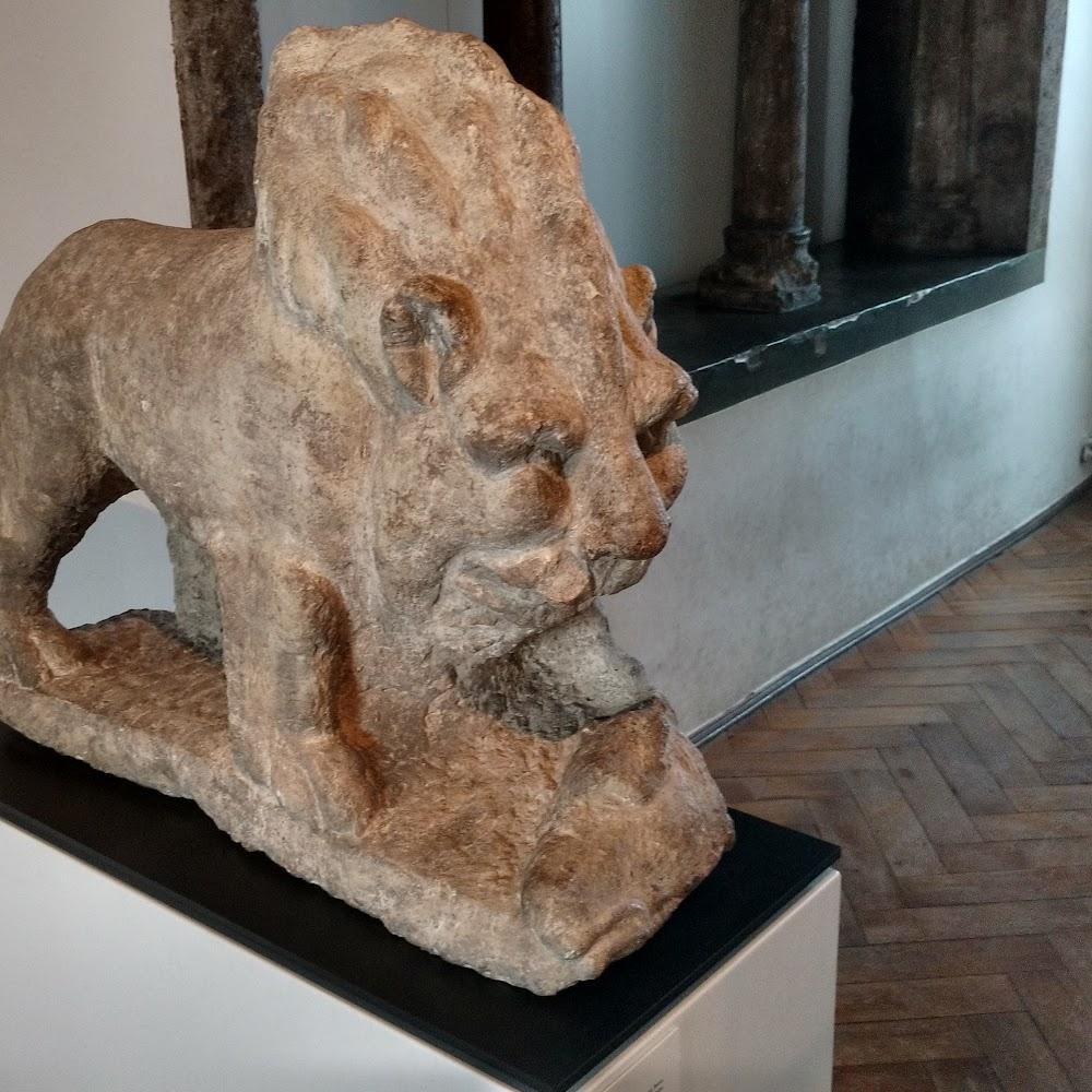 A stone lion sculpture on display.